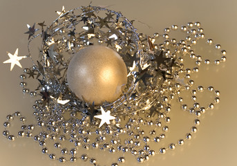 Christmas decoration with golden glittery ball and garlands