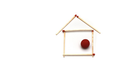 abstract house made of long match sticks isolated on white