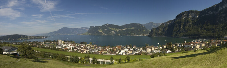 Fototapeta premium Large panorama of Swiss mountains and town by the lake of Luzern