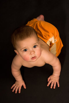 Crowling baby looks up