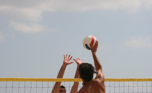 men play in volleyball competition