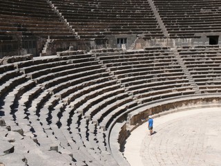 Ancient amphitheatre, rows of stairs and seats, Bosra, Syria
