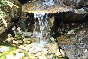 Landscape design statues in the park, artificial waterfall