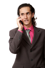 emotional businessman talking by mobile phone. on white