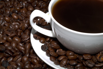 Coffee grains and coffee cup