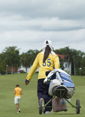 Obraz premium Golf caddie and player