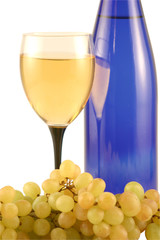 Bottle of wine, glass and grapes isolated on white .