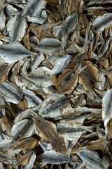 lots of sliced dried salty fish or anchoves