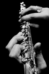 Flute in hands - music concept background