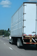 white semitruck on the freeway