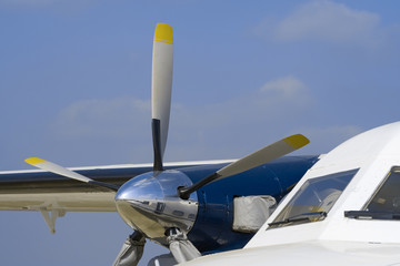 white aircraft with turbo-prop engine