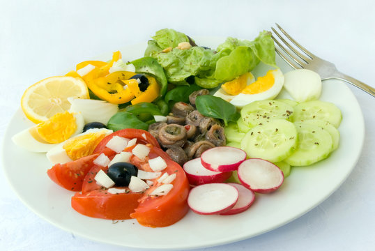 delicatessen anchovy mixed  - vegetable salad with boilrd eggs