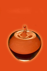 crystal apple on red background