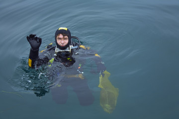 scuba diver after diving give ok sign