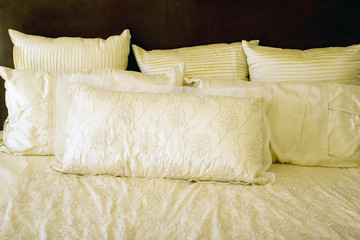 White bed with pillows