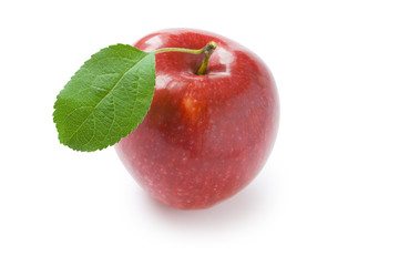 red apple with green leaf isolated on white