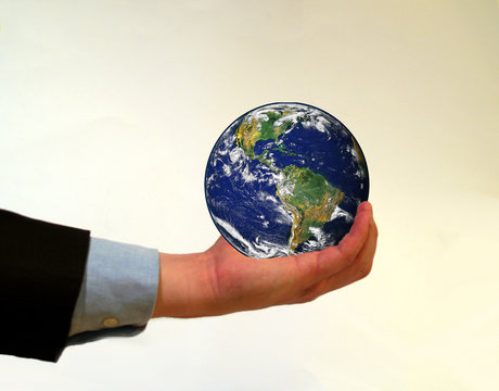 Businessman holding planet earth in his hand