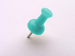 multicolored push pins on white - aqua