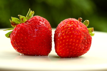 two wet strawberries