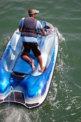 Obraz premium Cruising the Intercoastal on a Blue Jetski
