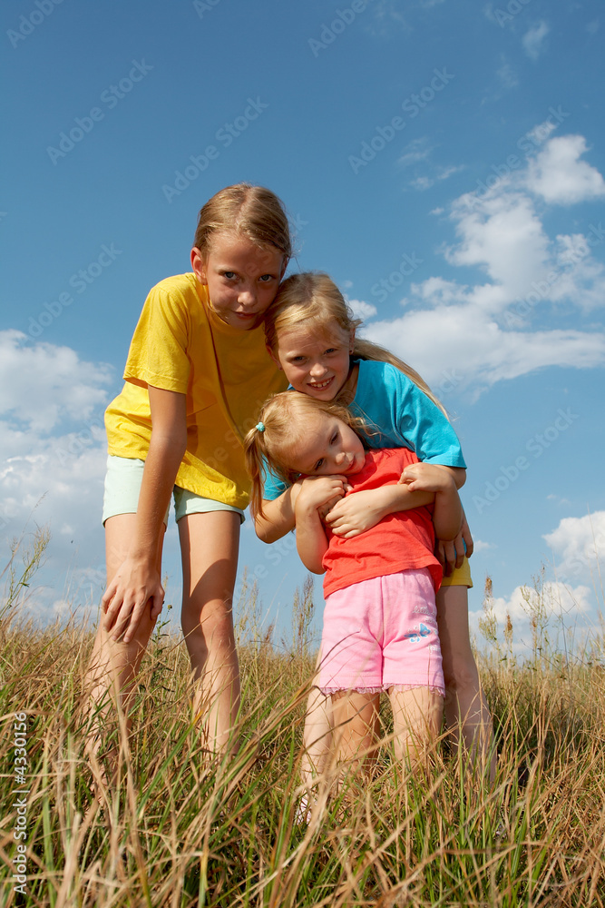 Wall mural Children on a meadow