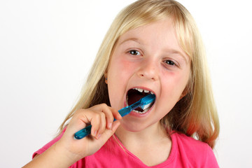 Young girl brushing her teeth