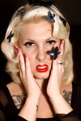 Blonde woman holding her face