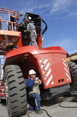Fototapeta premium auto engineers and giant truck