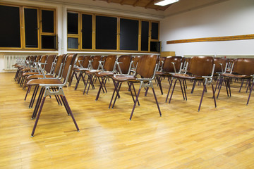 Empty classroom with school chairs