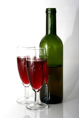 Wine Bottle and Red Wine in Glasses