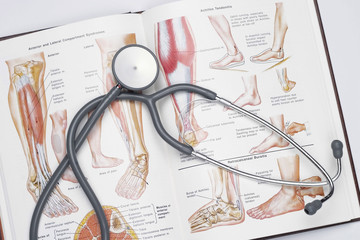 Surgeon's medical book and stethoscope