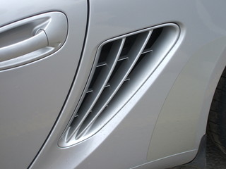 A View of an Air Vent on a Car.
