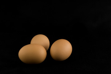 three eggs in black