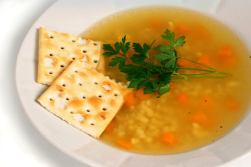 Chicken soup with crackers