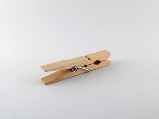 An isolated wooden clothespin