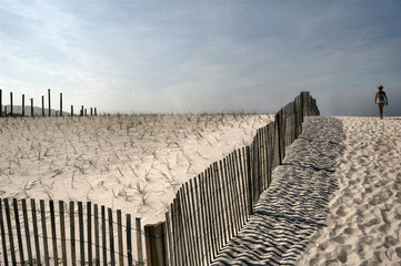 Woman walking to the beach.