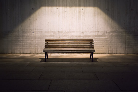 lonely bench in spotlight