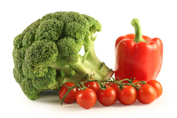 Broccoli, pepper and tomatoes on a white background