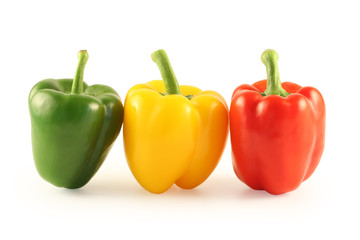 Three multi-coloured pepper isolated on white
