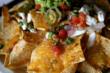 Detail of Deluxe serving of Nachos Grande in Mexican Restaurant