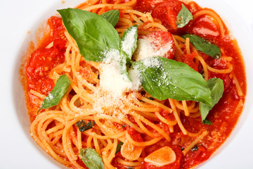Freshly cooked plate of spaghetti with tomato sauce and oregano