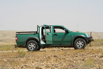 green pickup truck, in sede boker desert, israel