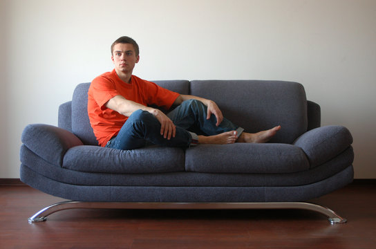 Sexy Man Sitting on the Sofa