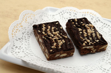 chocolate fudge brownies on cream background