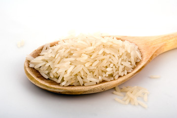 rice on wooden kitchen spoon