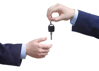 Person passing car keys against white background