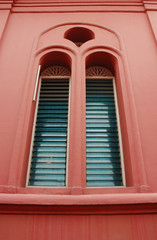 a window of an old colorful building