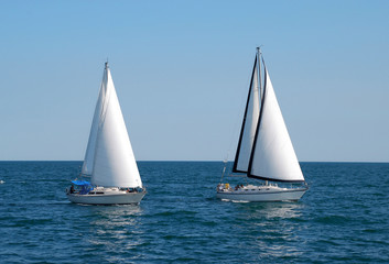 Fototapeta na wymiar Two sailboats on a summer day