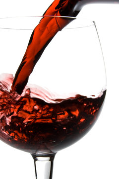 Wine pouring into glass from decanter