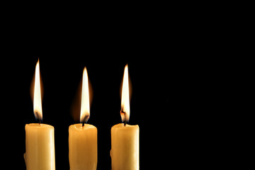 Three burning candles